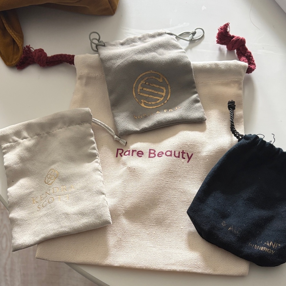 4 dust bag bundle including Rare Beauty Kendra Scott Alex and ani Sheila Fajl